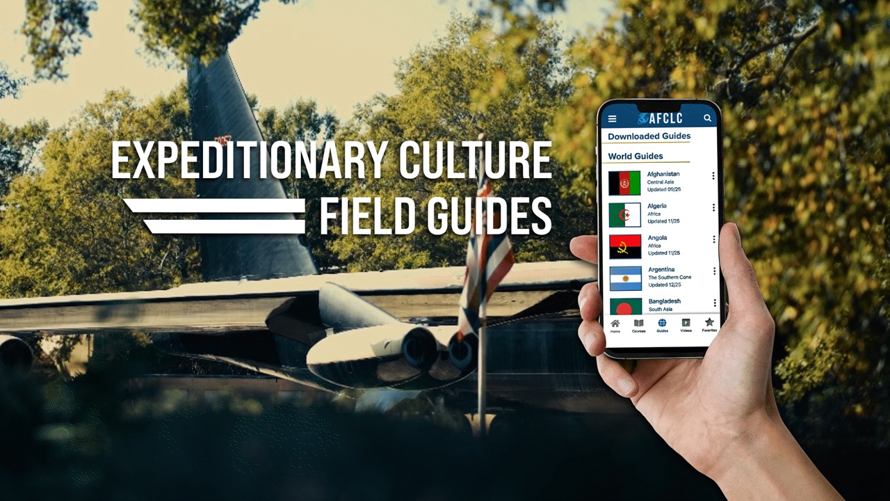 Airman holds Culture Guide Mobile App in their hands Airman holds Culture Guide Mobile App in their hands